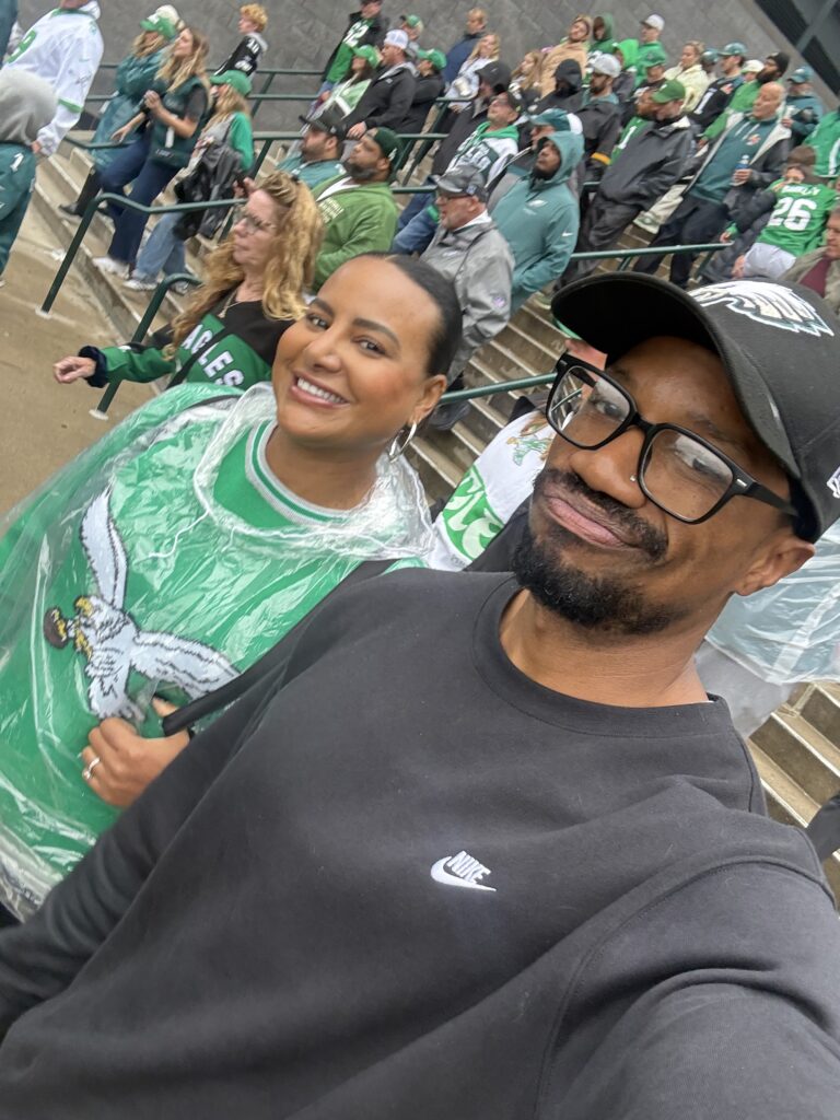 Brandon RaSean and Mariana attending a Philadelphia Eagles game.