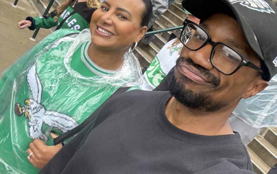 Brandon RaSean and Mariana attending a Philadelphia Eagles game.